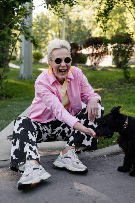 senior woman with dog at home