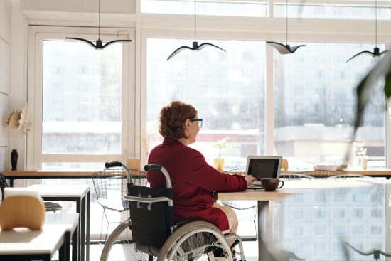 woman in kitchen remodel with wheelchair